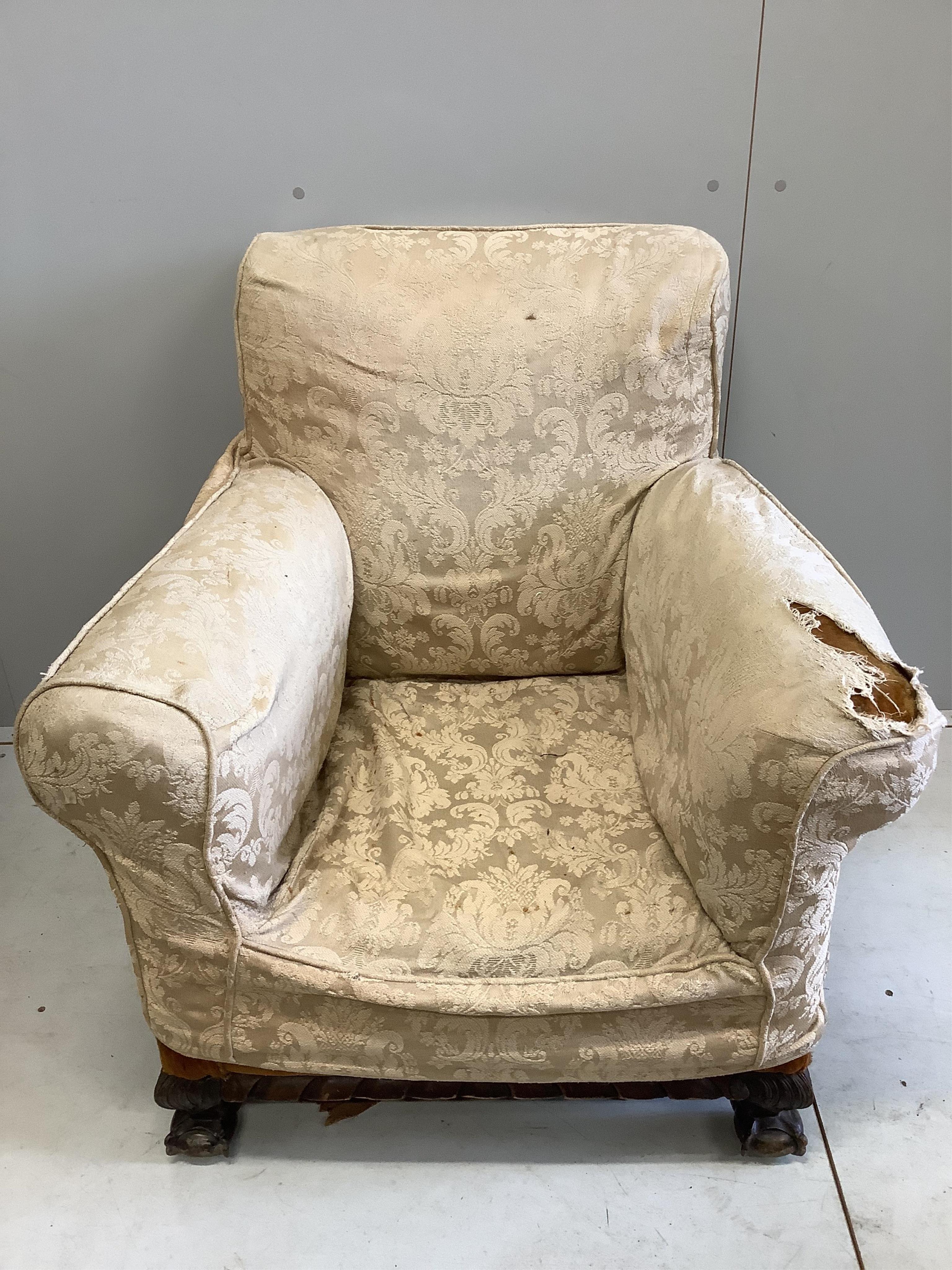 A near pair of early 20th century upholstered armchairs, larger width 81cm, depth 78cm, height 88cm. Condition - poor